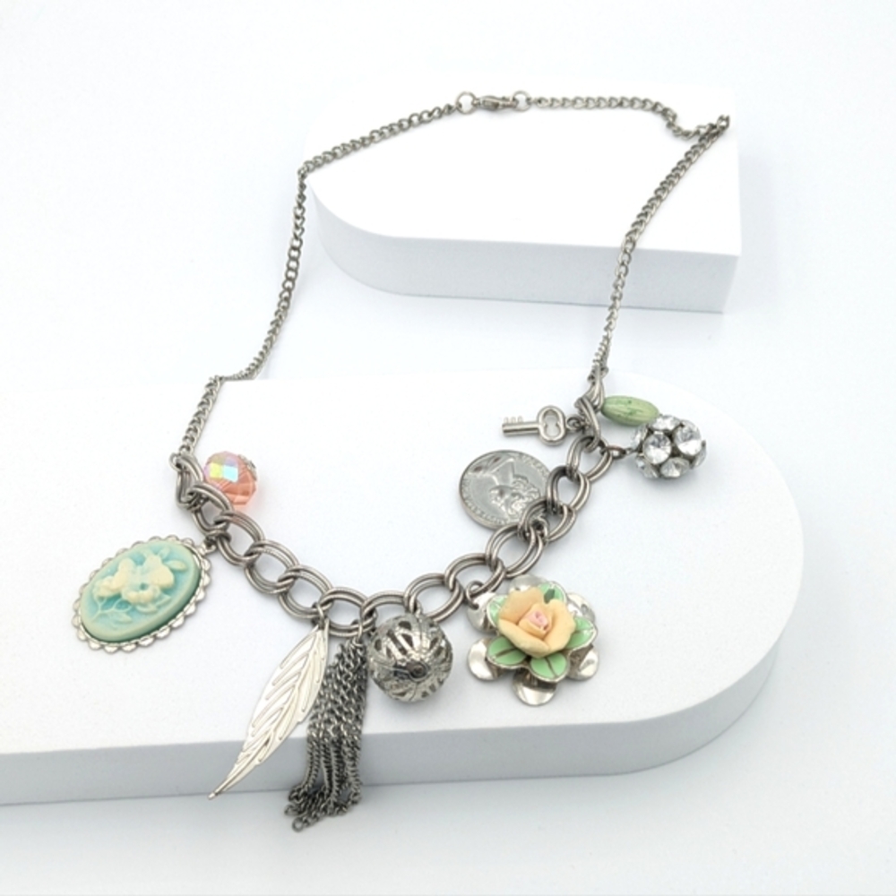 5/25$  Victorian-inspired upcycled charm necklace